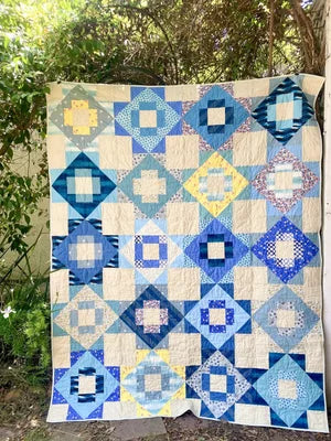 blue and yellow patchwork meadowland quilt